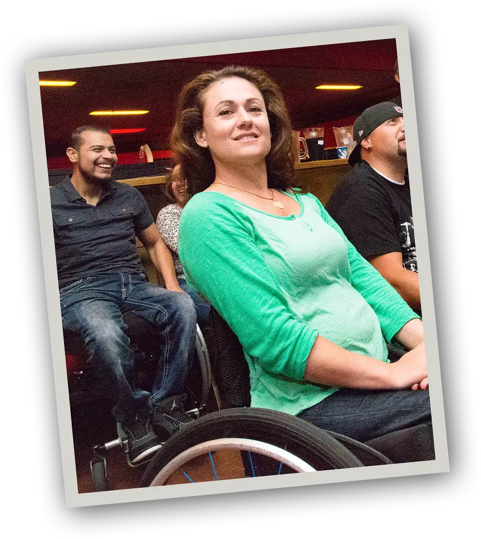 Photo of peers together at a bowling alley.